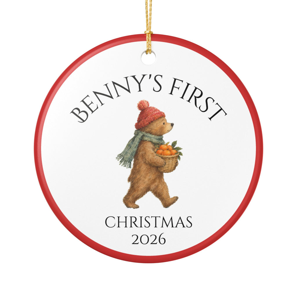 Personalized Baby's First Christmas 2026 ceramic ornament with a woodland bear carrying clementines