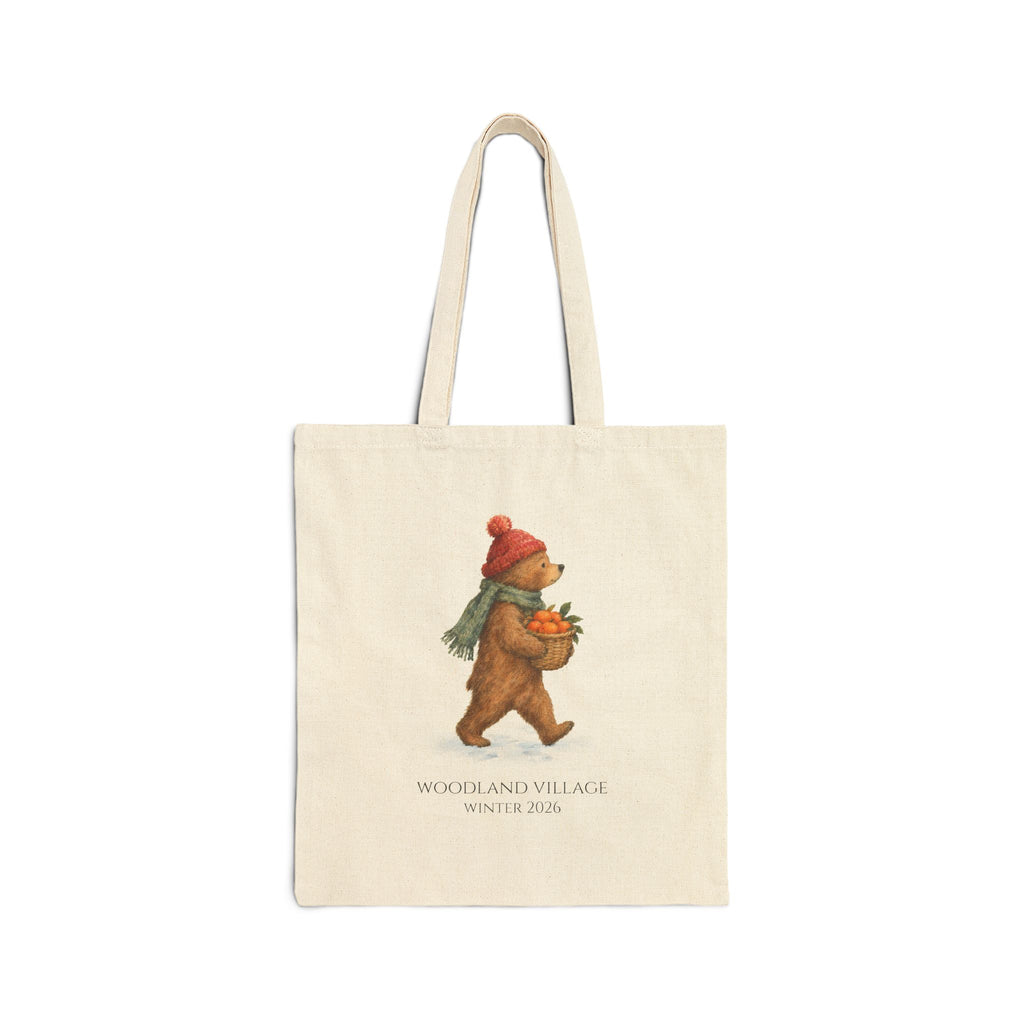 Natural canvas tote with a woodland bear in a red knit hat carrying clementines