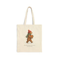 Natural canvas tote with a woodland bear in a red knit hat carrying clementines