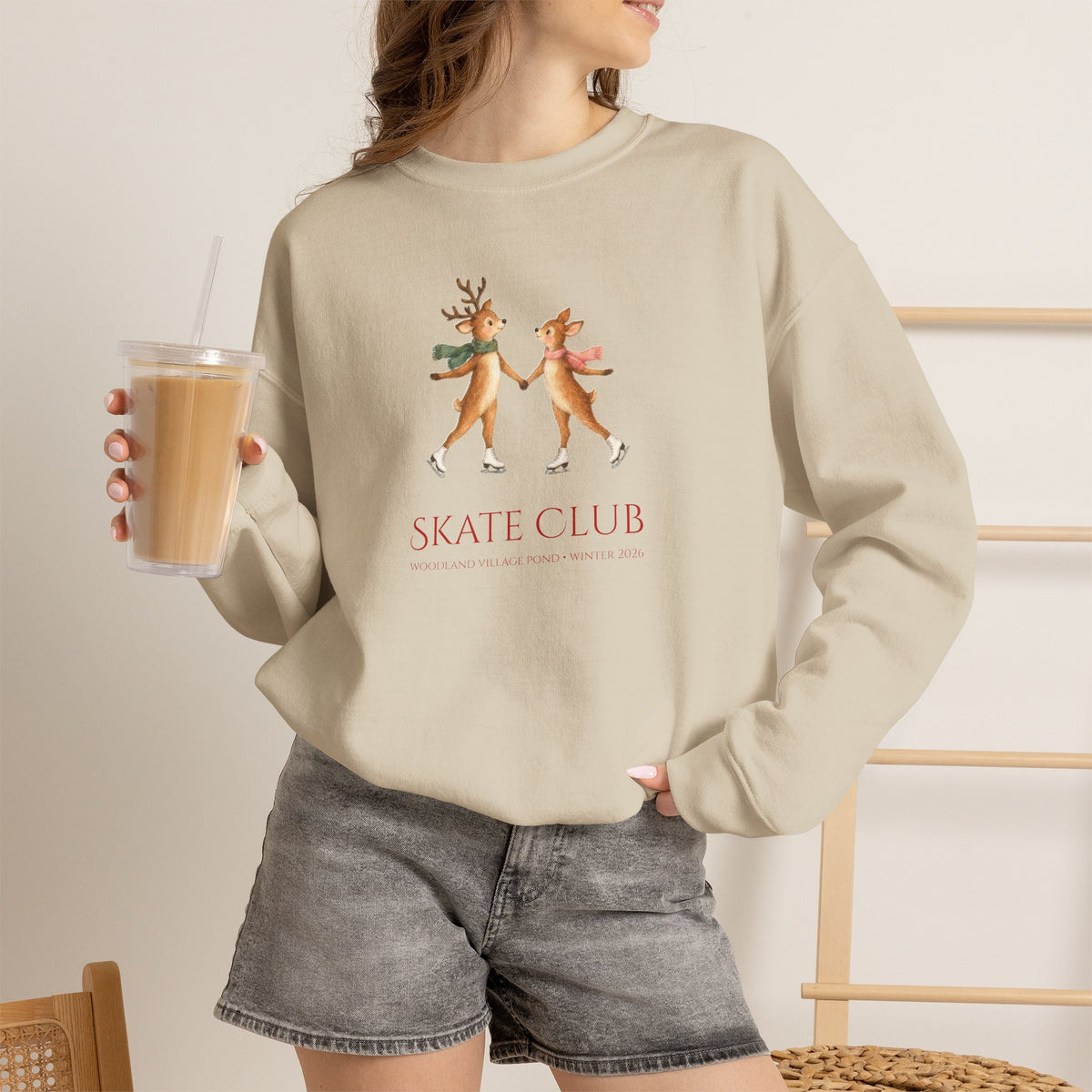 Woman wearing the Sand Woodland Village Skate Club sweatshirt