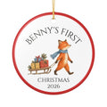 Personalized Baby's First Christmas 2026 ceramic ornament with a woodland fox pulling a sled of presents