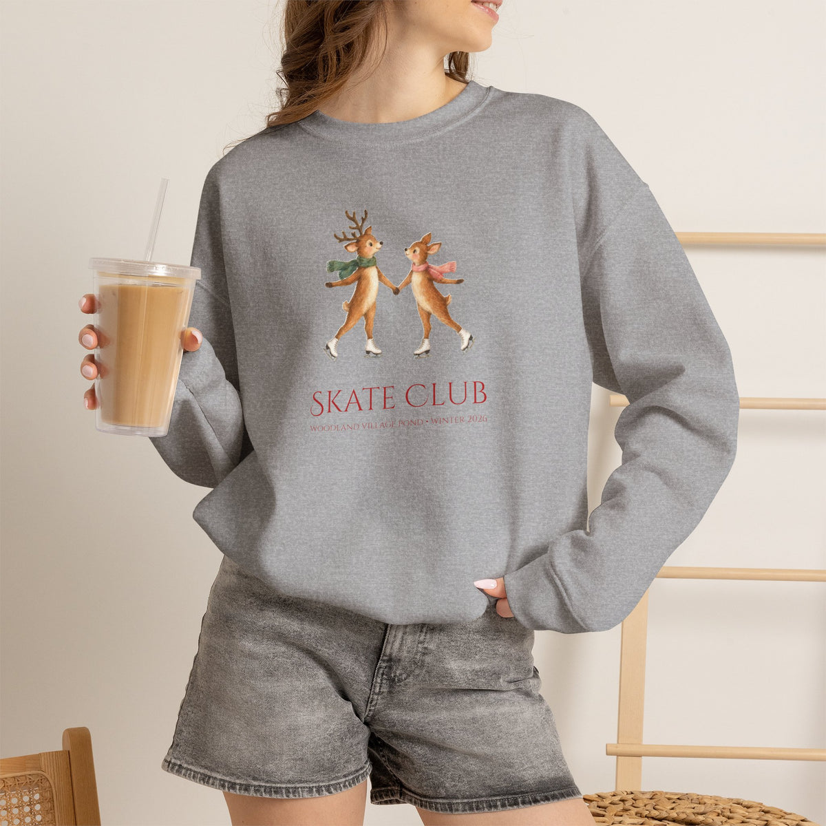 Woman wearing the Sport Grey Skate Club sweatshirt