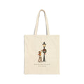 Natural canvas tote with a mouse on a ladder hanging a star by a wreathed lamppost